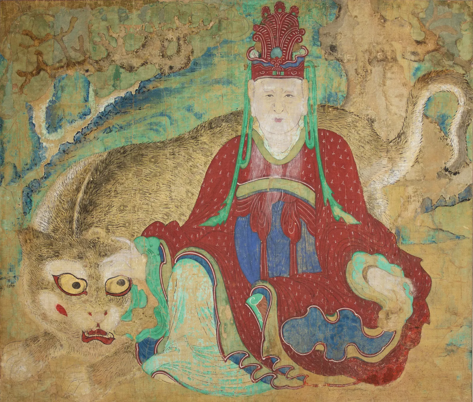조선 19세기 말 산신도. 붉은 관을 쓰고 흰 수염을 기른 산신이 붉은 겉옷에 푸른 옷을 받쳐 입고 화면 가운데 오른쪽에 앉아 있다. 그 뒤와 왼쪽으로 커다란 호랑이가 몸을 둥글게 감고 엎드려 있고, 호랑이의 노란 눈이 정면을 본다. 배경에는 청록색과 황토색의 바위와 나무가 굵게 칠해져 있다.